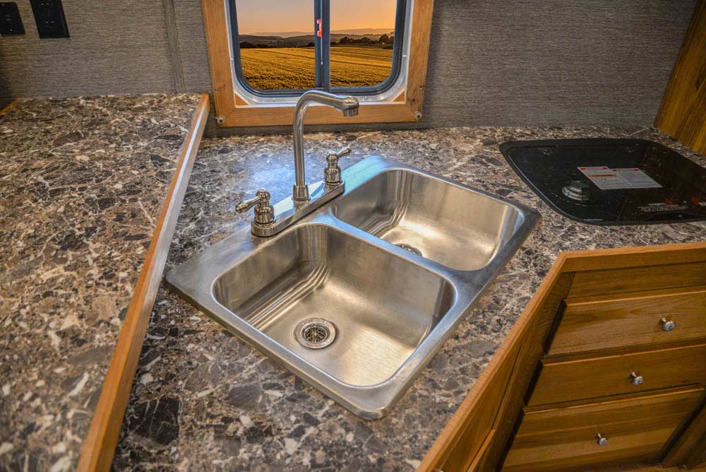 Sink in Kitchen in SL8X15SSRB Laramie Edition Horse Trailer | SMC Trailers