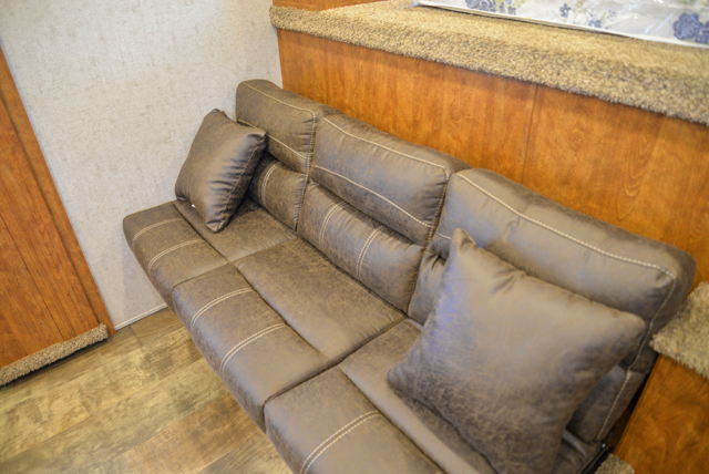 Sofa on riser in Patriot SP8X13SSR | SMC Trailers